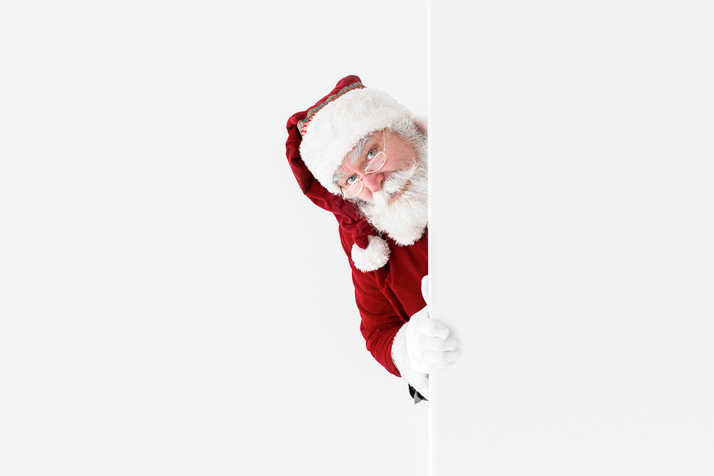 Santa peeking round a corner